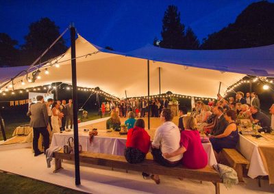 Wedding speeches under a white stretch tent in Essex