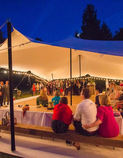 Wedding speeches under a white stretch tent in Essex