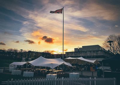 White stretch tents under a sunset