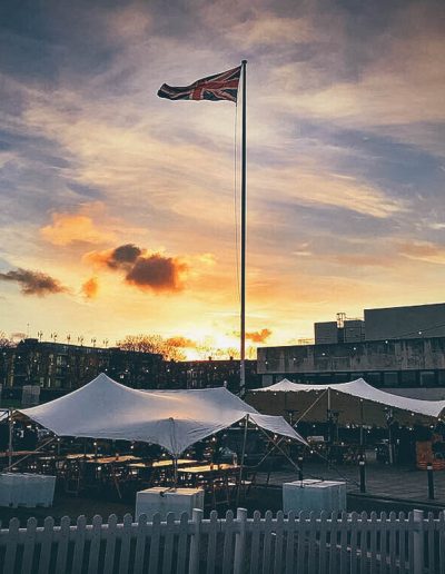 White stretch tents under a sunset