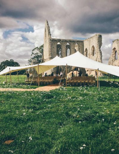 White stretch tent by ruins