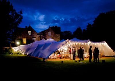 white stretch tent with festoons