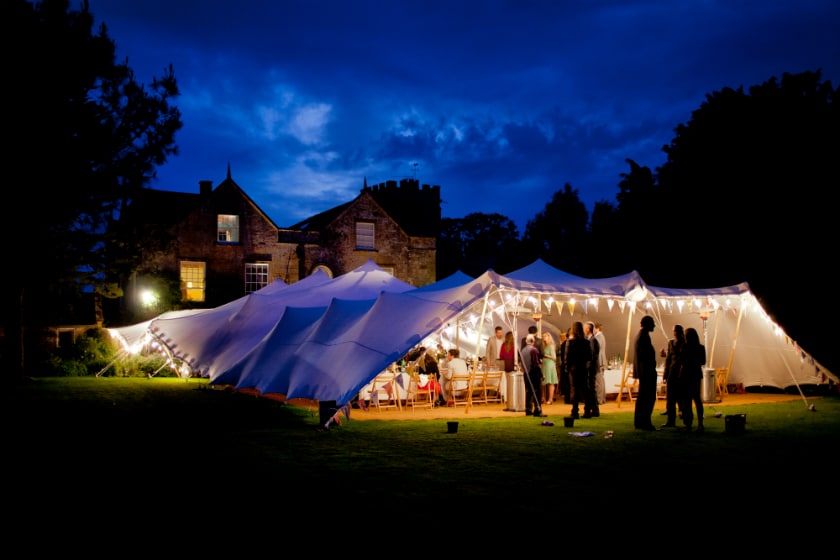 white stretch tent with festoons