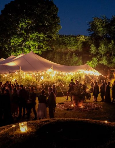 white stretch tent night with festoons