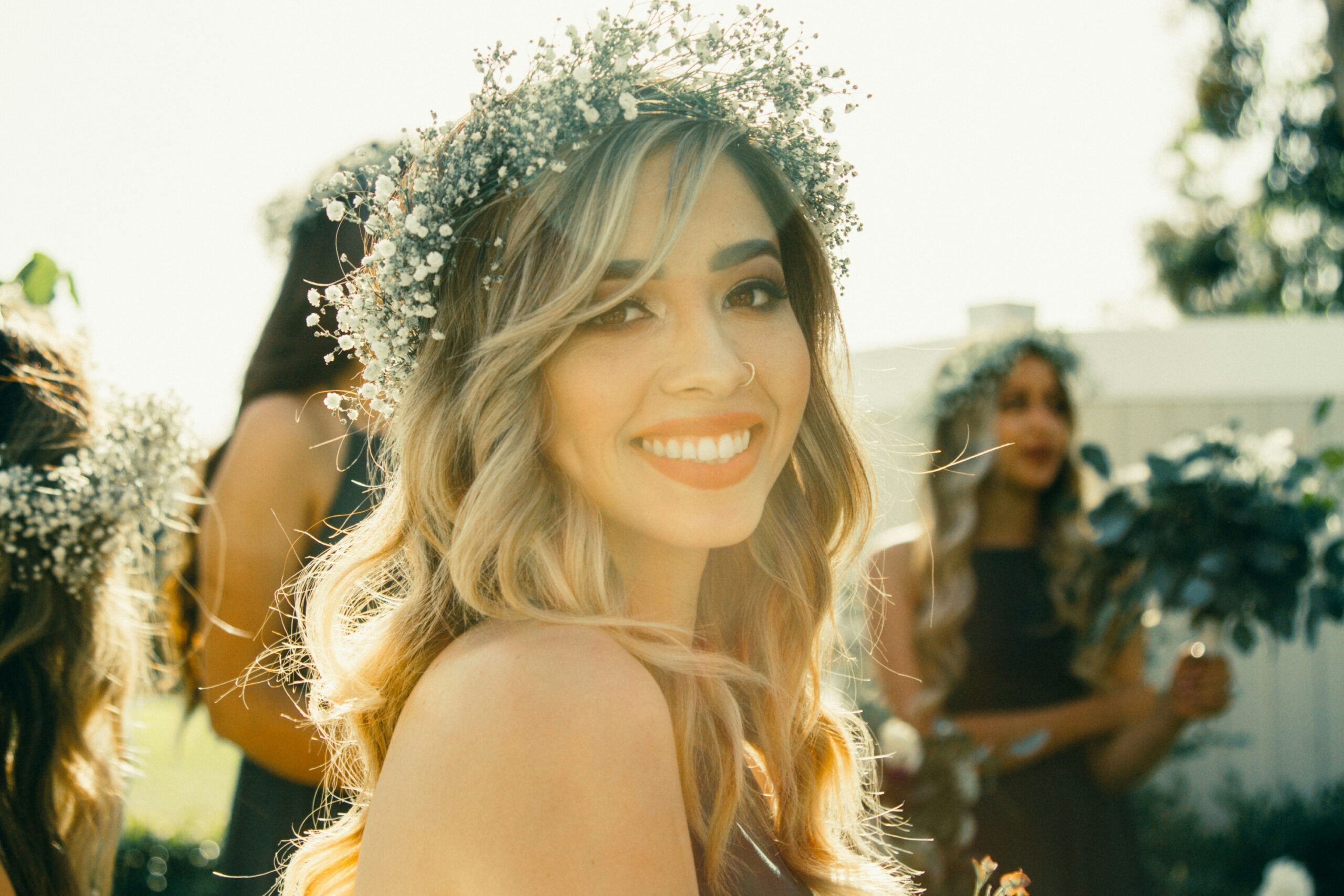 bridesmaids wearing flower crowns at festival wedding