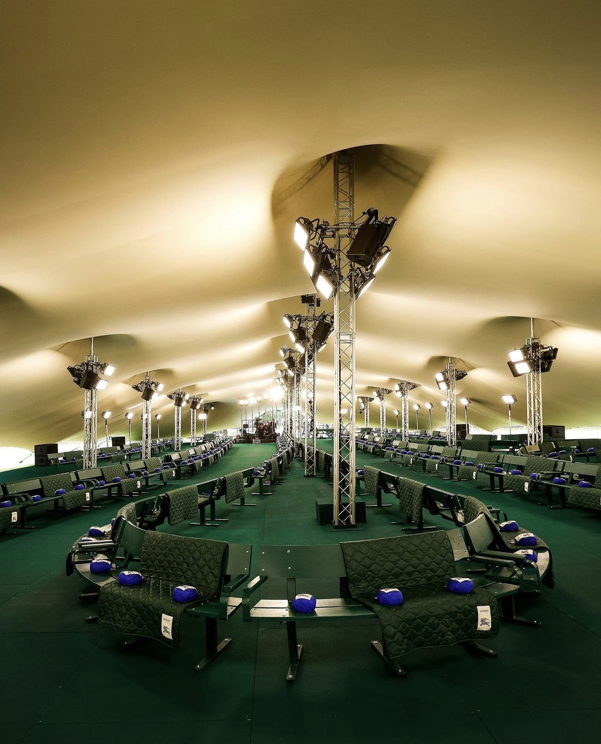 Inside the main runway tent, showing the truss king poles